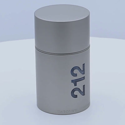 Carolina Herrera 212 Men NYC perfume bottle rotating on a white podium