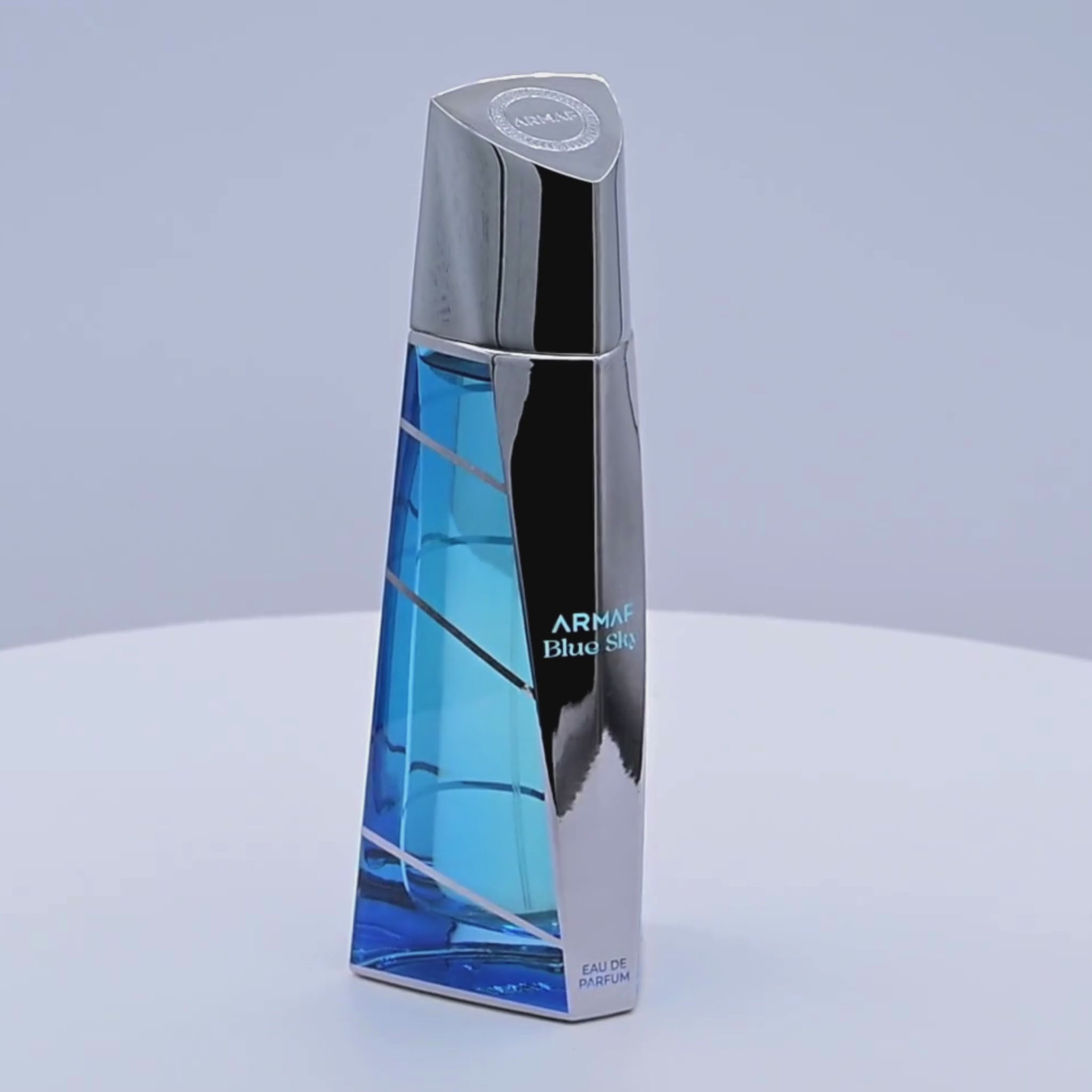 Armaf Blue Sky perfume bottle rotating on a white podium
