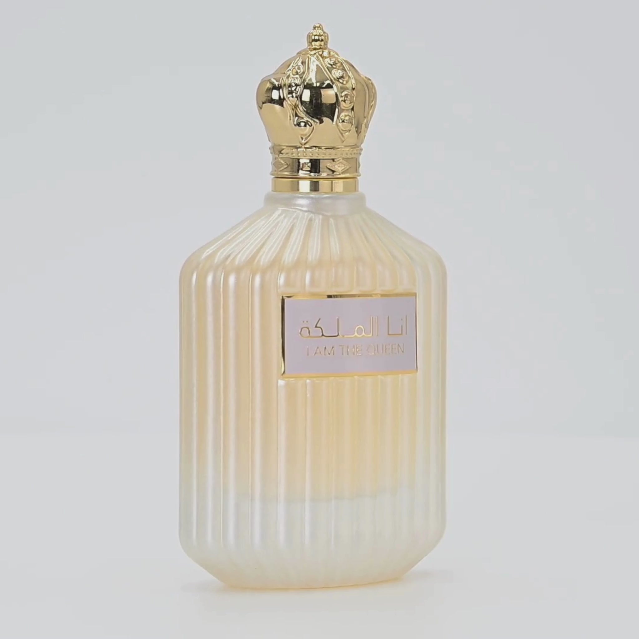 Ana Al Malikah perfume bottle rotating on a white podium