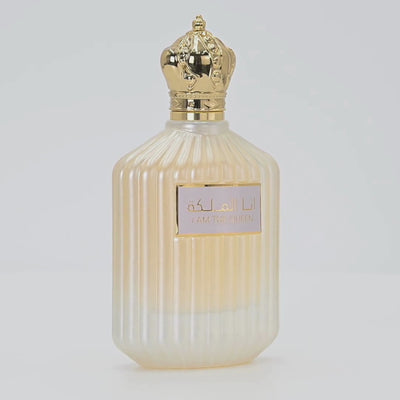 Ana Al Malikah perfume bottle rotating on a white podium