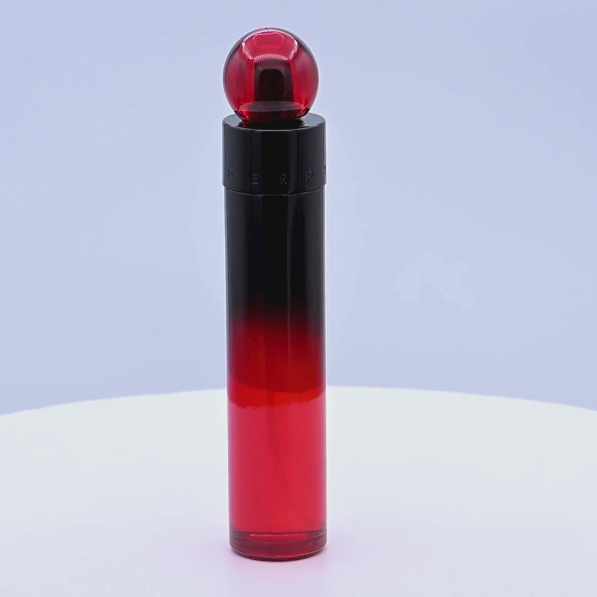 Perry Ellis 360 Red Profumo perfume bottle rotating on a white podium