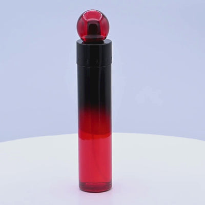 Perry Ellis 360 Red Profumo perfume bottle rotating on a white podium