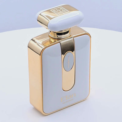 Gold and white perfume bottle with 'Elan' branding rotating on a white podium