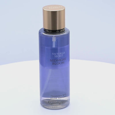 Victoria's Secret Midnight Bloom perfume bottle rotating on a white podium