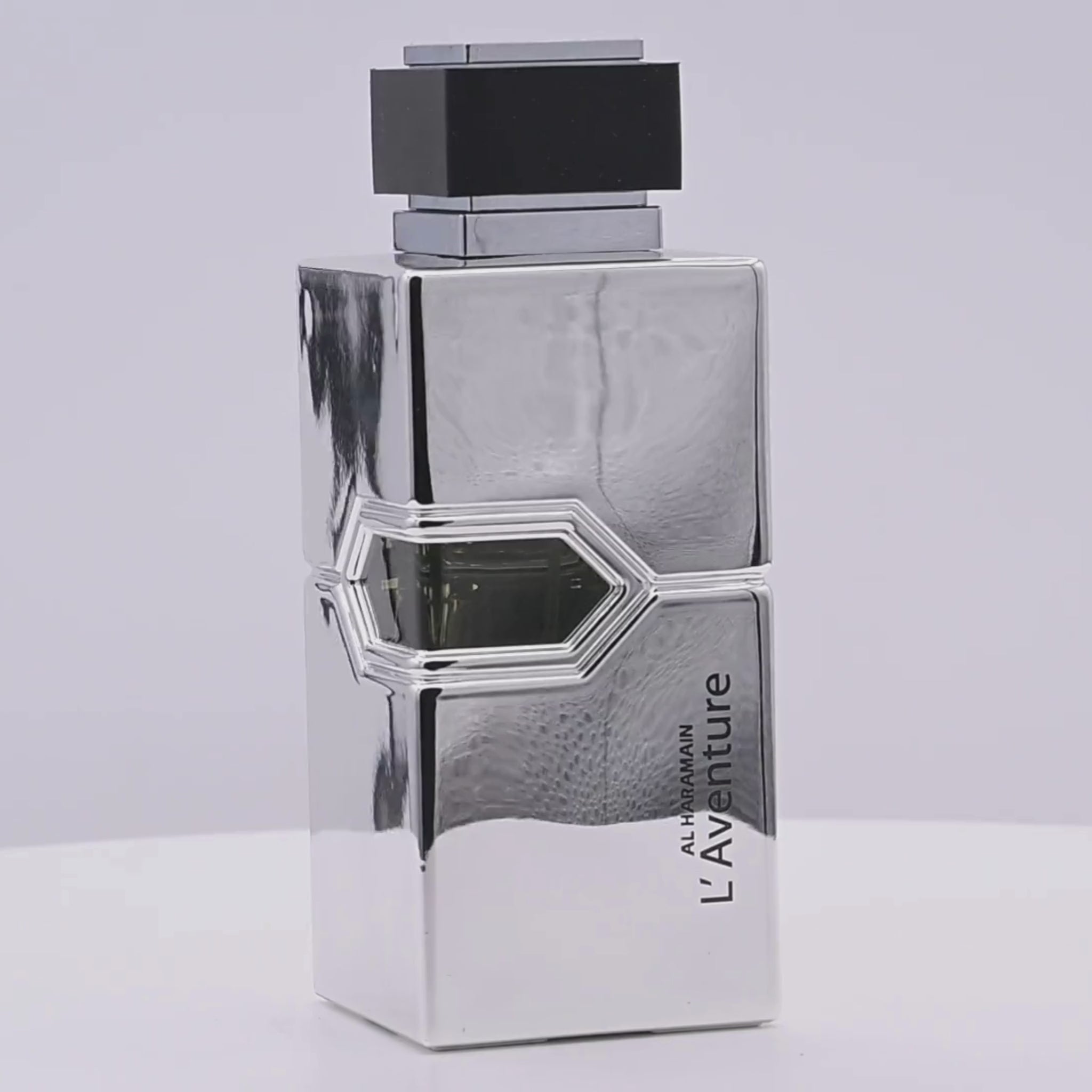 Rotating L'Aventure by Al Haramain bottle