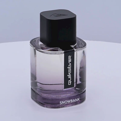 Quiksilver Snowbank perfume bottle rotating on a white podium