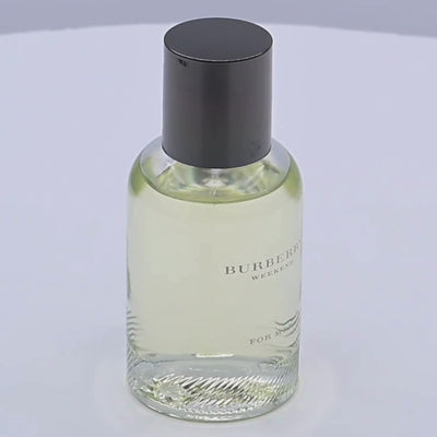 Burberry Weekend for men Eau de Toilette bottle rotating on a white podium