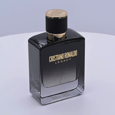 Cristiano Ronaldo Legacy perfume bottle rotating on a white podium